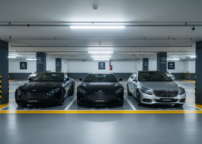3 luxury vehicles parked in underground parking